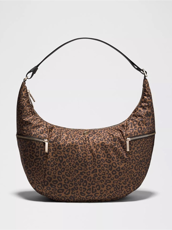 lululemon athletica Handbags - Lululemon Large Slouchy Sling Bag 13L
Metal Hardware leopard print NWT